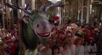 Movie still from “Return to Oz” (1985), directed by Walter Murch – A group of people in a room next to a large stuffed animal head; Medium shot, Low angle