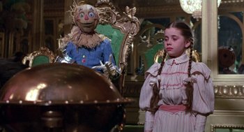 Movie still from “Return to Oz” (1985), directed by Walter Murch – A girl and a scarecrow in the wizard of oz; Medium shot, Low angle