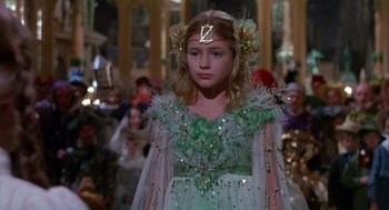 Movie still from “Return to Oz” (1985), directed by Walter Murch – A young girl in a green and white dress; Close Up shot, High angle