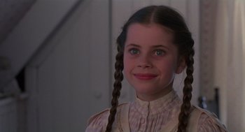 Movie still from “Return to Oz” (1985), directed by Walter Murch – A young girl with long braids wearing a white dress; Close Up shot, High angle