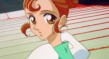Movie still from “Revolutionary Girl Utena: The Movie” (1999), directed by Katsushi Sakurabi – A woman's face in a cartoon; Close Up shot, High angle