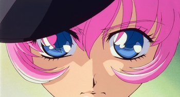 Movie still from “Revolutionary Girl Utena: The Movie” (1999), directed by Katsushi Sakurabi – View of a girl's face with blue and pink eyes; Extreme Close Up shot, Low angle