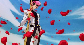 Movie still from “Revolutionary Girl Utena: The Movie” (1999), directed by Katsushi Sakurabi – A man with pink hair holding a stick in front of a sky filled with red petals; Medium shot, Low angle