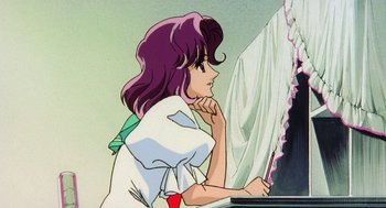 Movie still from “Revolutionary Girl Utena: The Movie” (1999), directed by Katsushi Sakurabi – A woman sitting at a table looking at a computer screen; Medium shot, Low angle