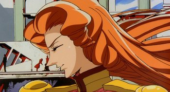 Movie still from “Revolutionary Girl Utena: The Movie” (1999), directed by Katsushi Sakurabi – A woman's face with long , red hair; Close Up shot, Low angle