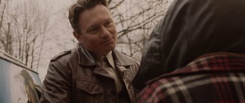 Movie still from “Rhymes for Young Ghouls” (2013), directed by Jeff Barnaby – A person wearing a leather jacket; Close Up shot, Over the shoulder angle