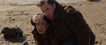 Movie still from “Rhymes for Young Ghouls” (2013), directed by Jeff Barnaby – A man and a woman on the beach; Close Up shot, Over the shoulder angle