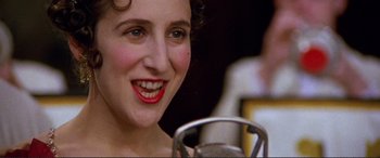 Movie still from “Richard III” (1995), directed by Richard Loncraine – A person with red lipstick on their lips; Close Up shot, High angle
