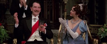 Movie still from “Richard III” (1995), directed by Richard Loncraine – A man and a woman dressed in formal wear; Medium shot, Low angle