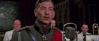 Movie still from “Richard III” (1995), directed by Richard Loncraine – A person wearing a military uniform; Close Up shot, Low angle