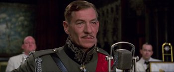 Movie still from “Richard III” (1995), directed by Richard Loncraine – A person wearing a military uniform; Close Up shot, Low angle