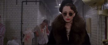 Movie still from “Richard III” (1995), directed by Richard Loncraine – A woman wearing a fur coat and a hat; Medium shot, Low angle