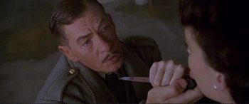 Movie still from “Richard III” (1995), directed by Richard Loncraine – A person holding a knife; Close Up shot, High angle