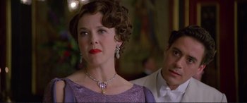 Movie still from “Richard III” (1995), directed by Richard Loncraine – A person wearing a necklace; Close Up shot, Over the shoulder angle