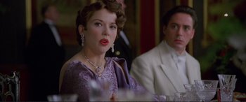 Movie still from “Richard III” (1995), directed by Richard Loncraine – A woman in a purple dress and a man in a white suit; Close Up shot, Low angle
