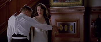 Movie still from “Richard III” (1995), directed by Richard Loncraine – A man and a woman in a white dress; Close Up shot, High angle