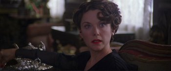 Movie still from “Richard III” (1995), directed by Richard Loncraine – A person with short hair; Close Up shot, Over the shoulder angle