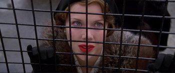 Movie still from “Richard III” (1995), directed by Richard Loncraine – A person behind a fence; Close Up shot, Overhead angle