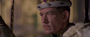 Movie still from “Richard III” (1995), directed by Richard Loncraine – A person wearing a crown; Close Up shot, Low angle