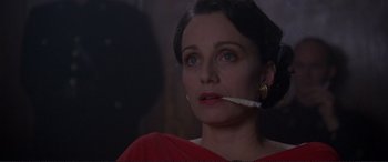 Movie still from “Richard III” (1995), directed by Richard Loncraine – A woman is holding a cigarette in her mouth; Close Up shot, Low angle