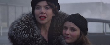 Movie still from “Richard III” (1995), directed by Richard Loncraine – A woman and a girl wearing hats and fur coats; Close Up shot, Low angle