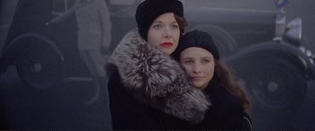 Movie still from “Richard III” (1995), directed by Richard Loncraine – Two women are posing for a picture together; Close Up shot, Low angle