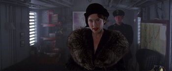 Movie still from “Richard III” (1995), directed by Richard Loncraine – A woman wearing a hat and a fur coat; Close Up shot, Over the shoulder angle