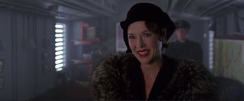 Movie still from “Richard III” (1995), directed by Richard Loncraine – A woman with red lipstick wearing a black hat; Close Up shot, Low angle