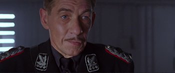 Movie still from “Richard III” (1995), directed by Richard Loncraine – A person wearing a uniform; Close Up shot, Low angle