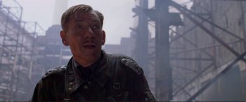 Movie still from “Richard III” (1995), directed by Richard Loncraine – A person wearing a military uniform; Close Up shot, Low angle