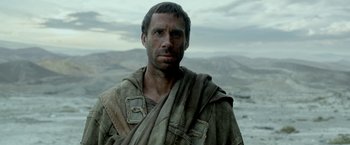 Movie still from “Risen” (2016), directed by Kevin Reynolds – A person wearing a robe; Close Up shot, Over the shoulder angle