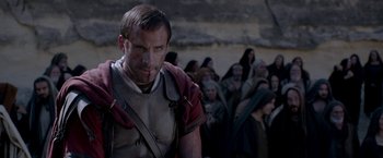 Movie still from “Risen” (2016), directed by Kevin Reynolds – A man in roman garb standing in front of a group of people; Close Up shot, Over the shoulder angle