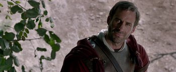 Movie still from “Risen” (2016), directed by Kevin Reynolds – A person wearing a costume; Close Up shot, Over the shoulder angle