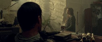 Movie still from “Risen” (2016), directed by Kevin Reynolds – A man sitting in front of a bathroom mirror; Medium shot, Over the shoulder angle