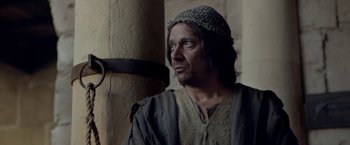 Movie still from “Risen” (2016), directed by Kevin Reynolds – A man wearing a hat looking up at the sky; Close Up shot, Low angle