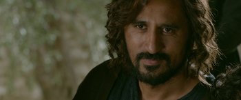 Movie still from “Risen” (2016), directed by Kevin Reynolds – A person with a beard; Close Up shot, Over the shoulder angle