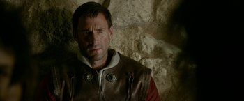 Movie still from “Risen” (2016), directed by Kevin Reynolds – A person wearing a leather vest; Close Up shot, Over the shoulder angle