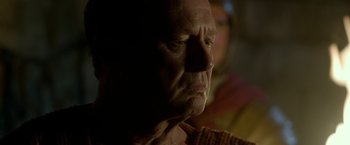 Movie still from “Risen” (2016), directed by Kevin Reynolds – An older man is looking into the distance; Close Up shot, Over the shoulder angle