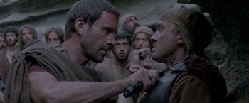 Movie still from “Risen” (2016), directed by Kevin Reynolds – A group of men standing next to each other; Close Up shot, Over the shoulder angle