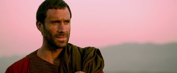 Movie still from “Risen” (2016), directed by Kevin Reynolds – A person with a beard; Close Up shot, Over the shoulder angle