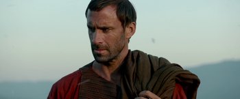 Movie still from “Risen” (2016), directed by Kevin Reynolds – A person wearing a robe; Close Up shot, Over the shoulder angle