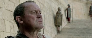 Movie still from “Risen” (2016), directed by Kevin Reynolds – An older man looking up into the sky; Close Up shot, Low angle