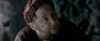 Movie still from “Risen” (2016), directed by Kevin Reynolds – A person wearing a hat; Close Up shot, Over the shoulder angle