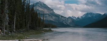 Movie still from “River of No Return” (1954), directed by Otto Preminger – A body of water with a mountain in the background; Extreme Wide shot, High angle