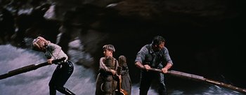 Movie still from “River of No Return” (1954), directed by Otto Preminger – A group of people standing on top of a hill; Medium shot, Low angle