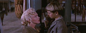 Movie still from “River of No Return” (1954), directed by Otto Preminger – A woman and a young boy face each other; Close Up shot, Over the shoulder angle