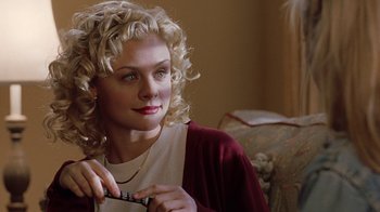 Movie still from “Road Trip” (2000), directed by Todd Phillips – A woman with blonde curly hair holding a pair of scissors; Close Up shot, Over the shoulder angle