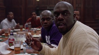 Movie still from “Road Trip” (2000), directed by Todd Phillips – A group of men sitting at a table eating food; Close Up shot, Over the shoulder angle