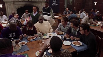 Movie still from “Road Trip” (2000), directed by Todd Phillips – A group of people sitting around a table eating; Wide shot, High angle