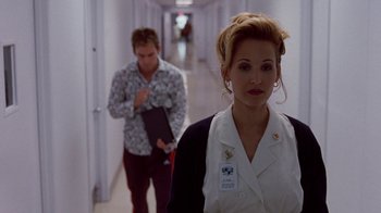 Movie still from “Road Trip” (2000), directed by Todd Phillips – A man and a woman walking down a hall way; Medium shot, Over the shoulder angle